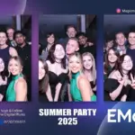 Group of friends posing at a summer party photo booth
