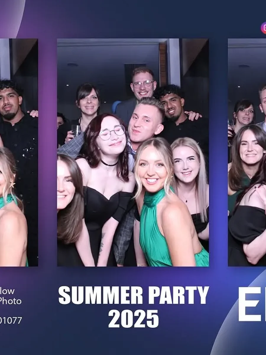 Group of guests in black and green outfits posing with photo booth props Corporate booth hire