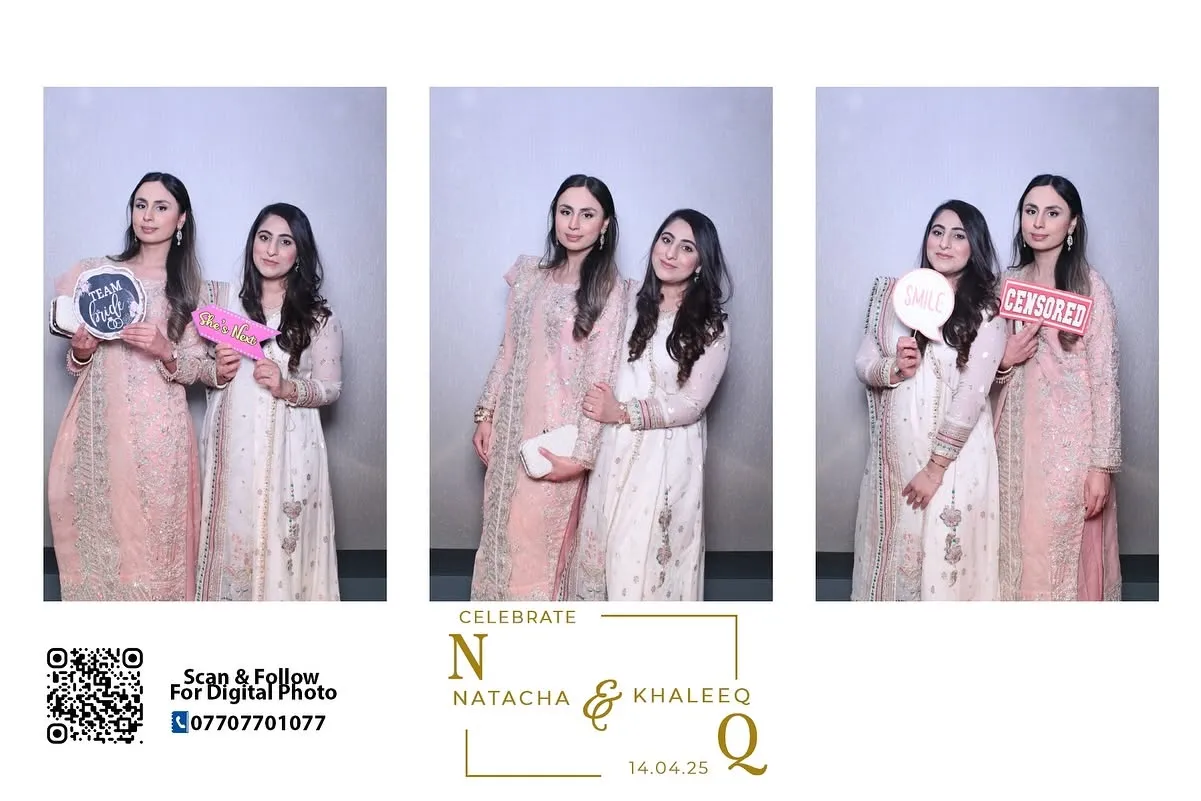 Three women in light outfits posing together in a Magic Mirror photo booth frame