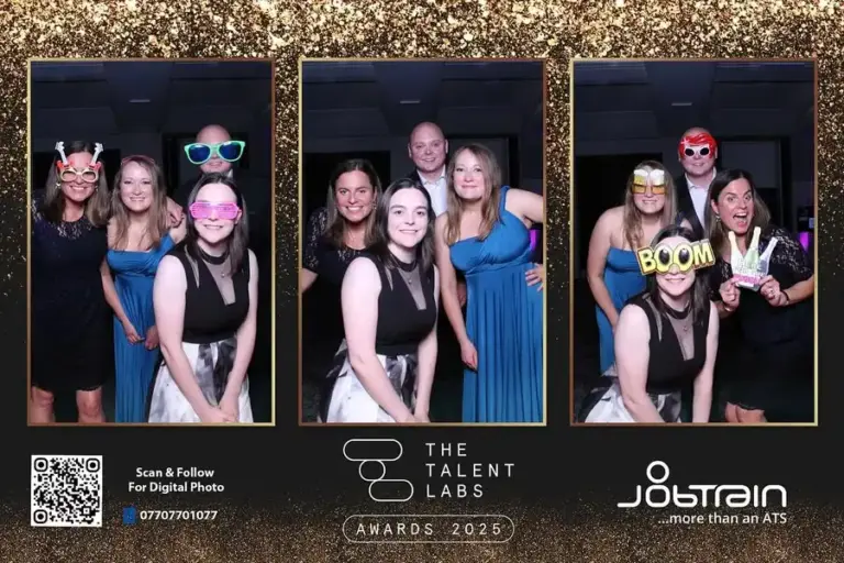 Guests posing with microphone props at corporate party