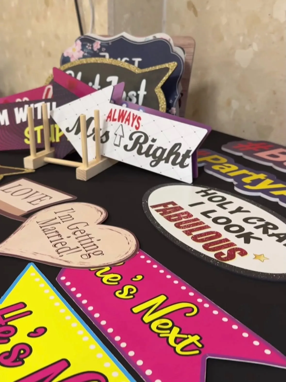 Photo booth party props laid out on a table