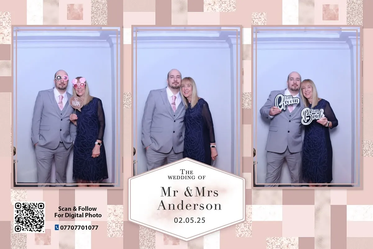 a couple posing with props in a photo in wedding booth hire