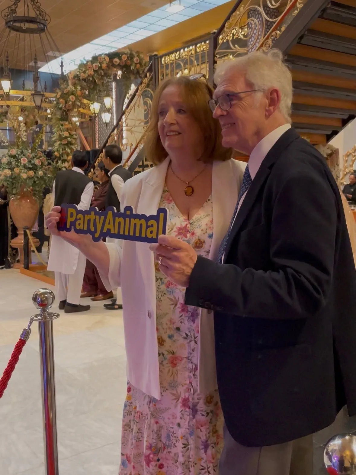 Older couple enjoying a Magic Mirror photo booth moment at a party